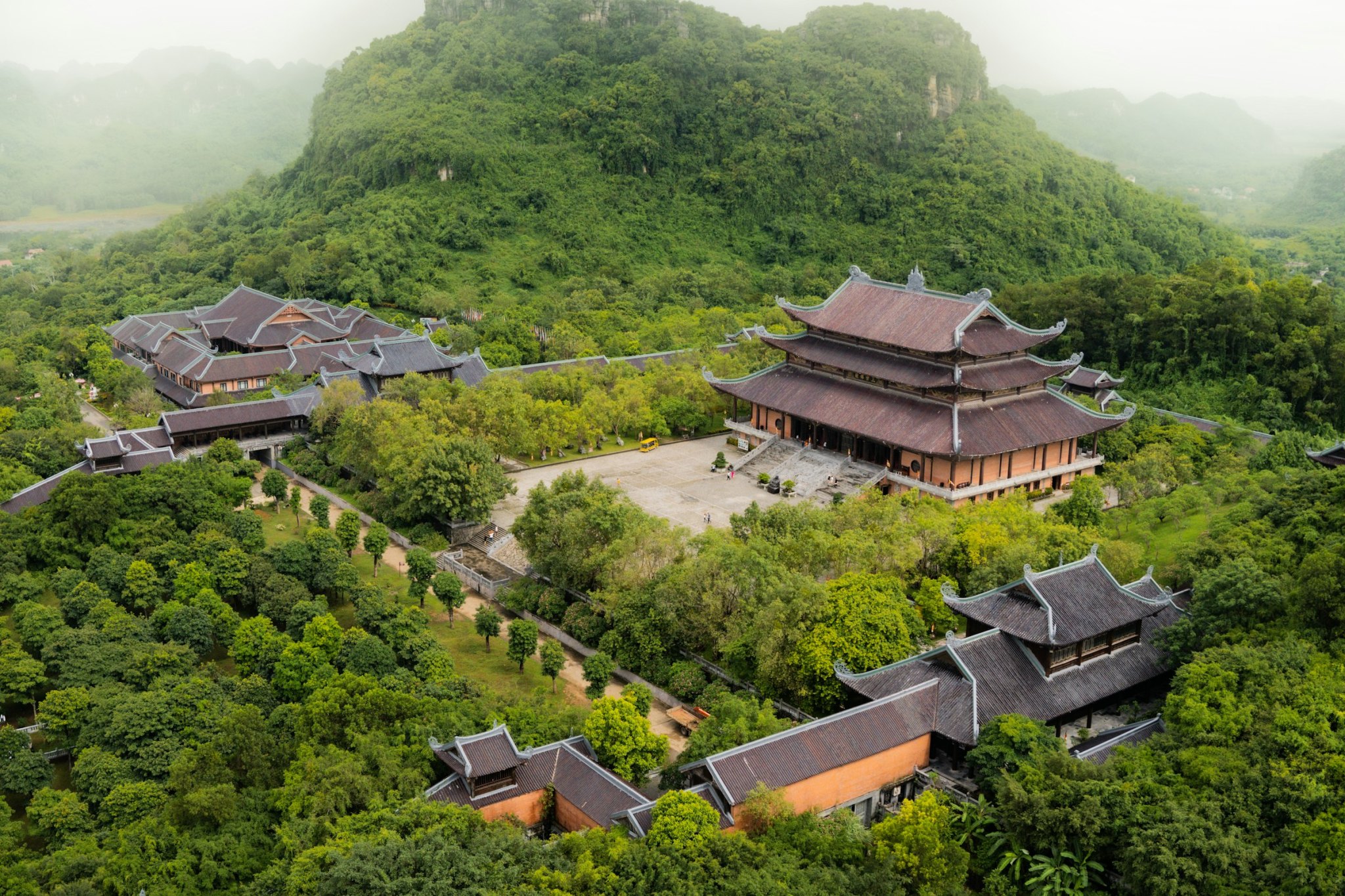 Aerial view of Bai Dinh Pagoda among green forest, Ninh Binh