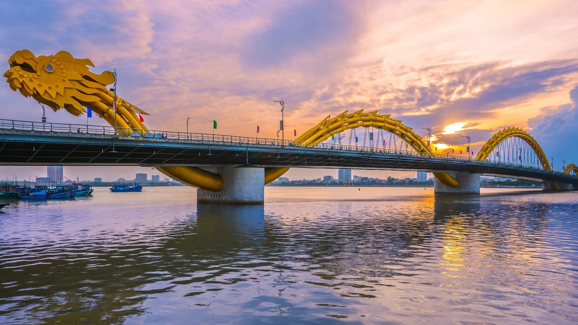Dragon Bridge over the Han River in Da Nang at sunset