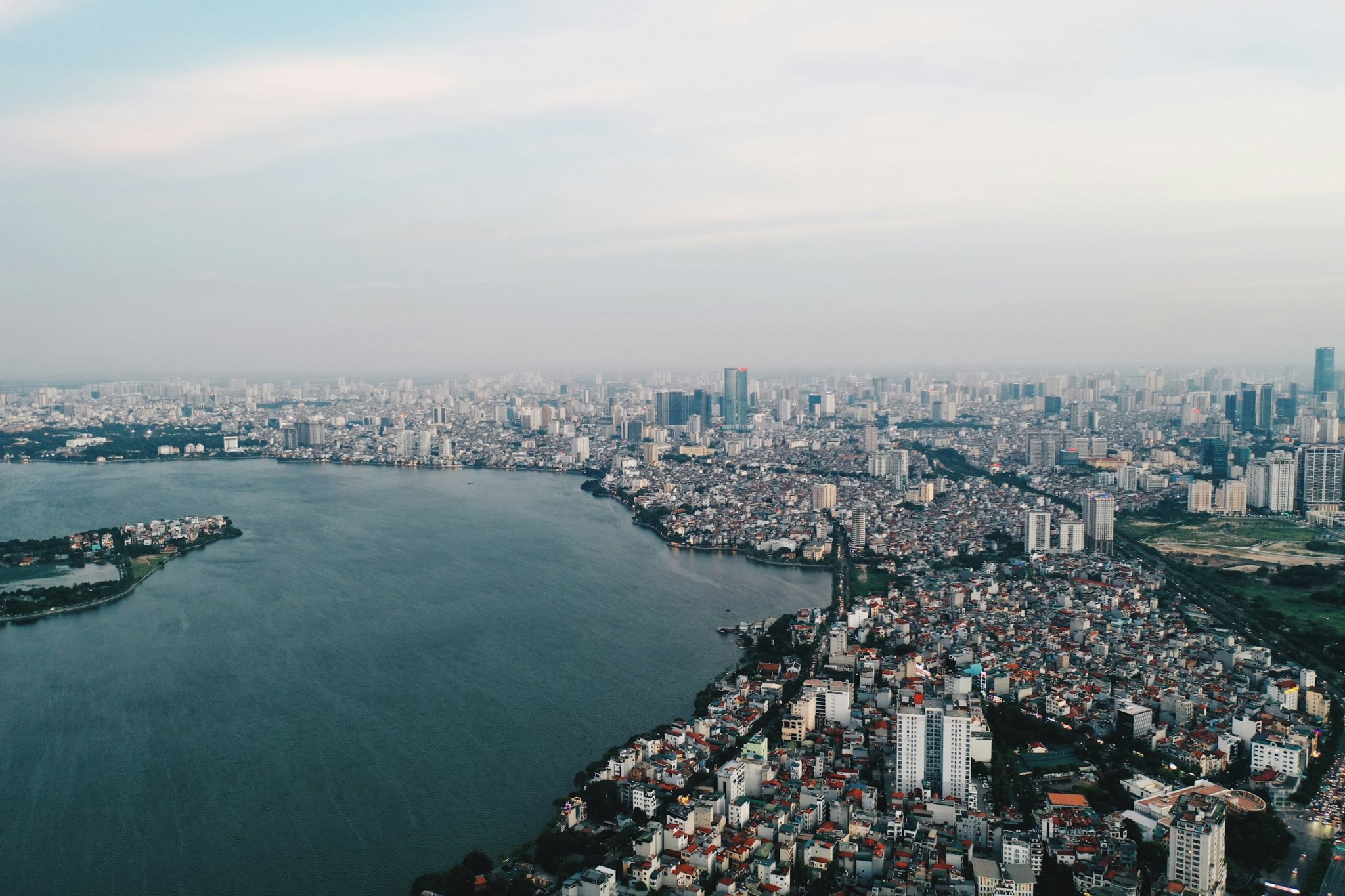 Aerial view over West Lake and the Hanoi skyline