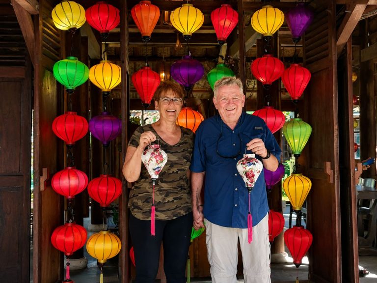 Couple holding the silk lanterns they made in Hoi An