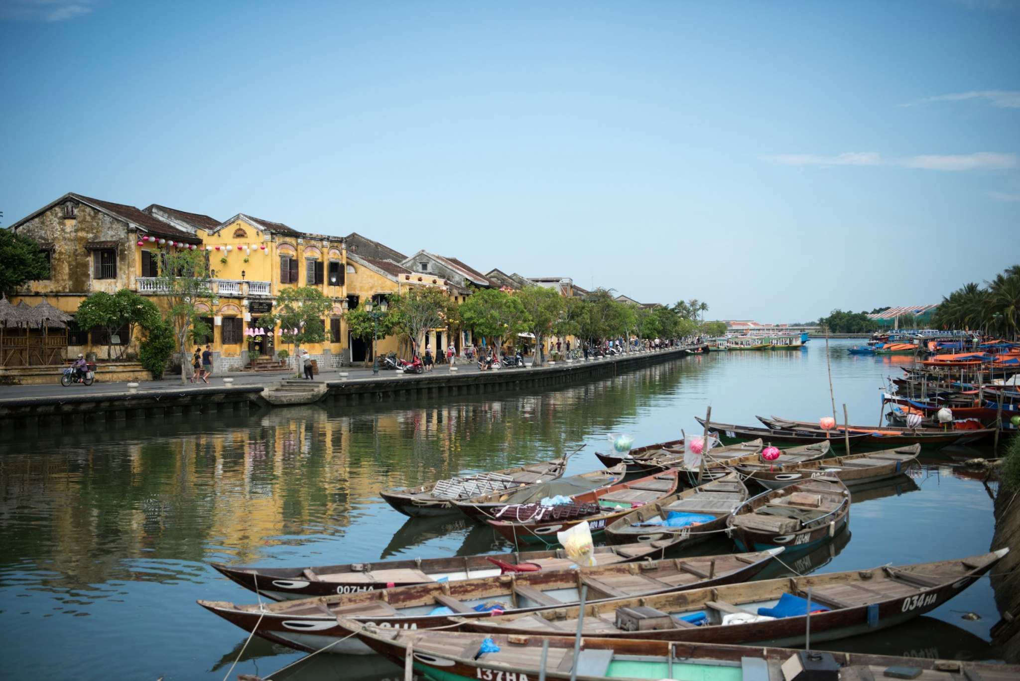 Yellow houses of Hoi An Ancient Town along the Thu Bon River on a clear day