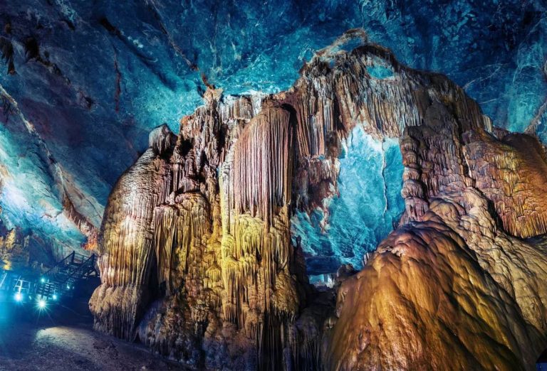 Illuminated stalactites inside Paradise Cave - Rose Travel