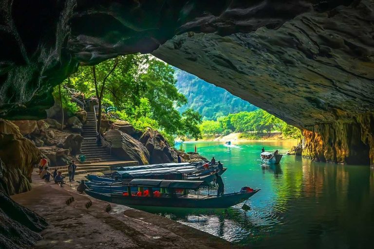 Dragon boats at the mouth of Phong Nha Cave