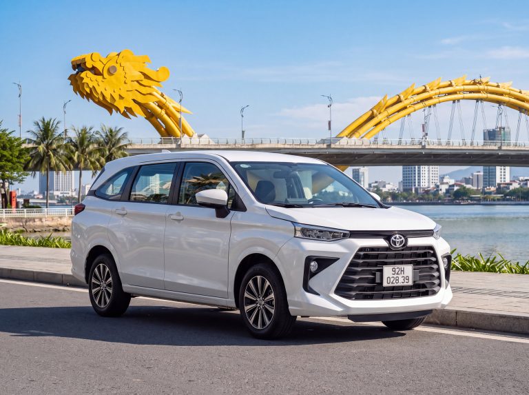 Rose Travel Toyota Avanza 7-seater by the Han River with the Dragon Bridge behind, Da Nang